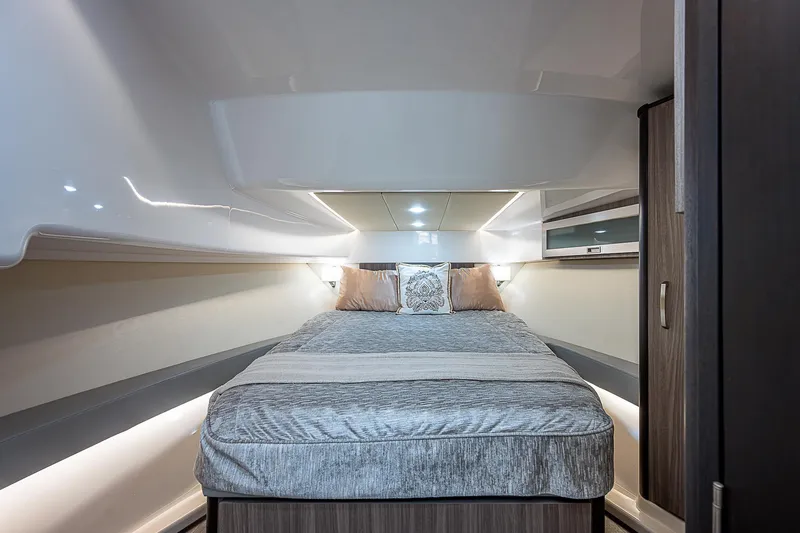 Slide: The Image of Luxurious interior cabin of 2022 Regal 36 XO yacht with cozy bedding. - 8