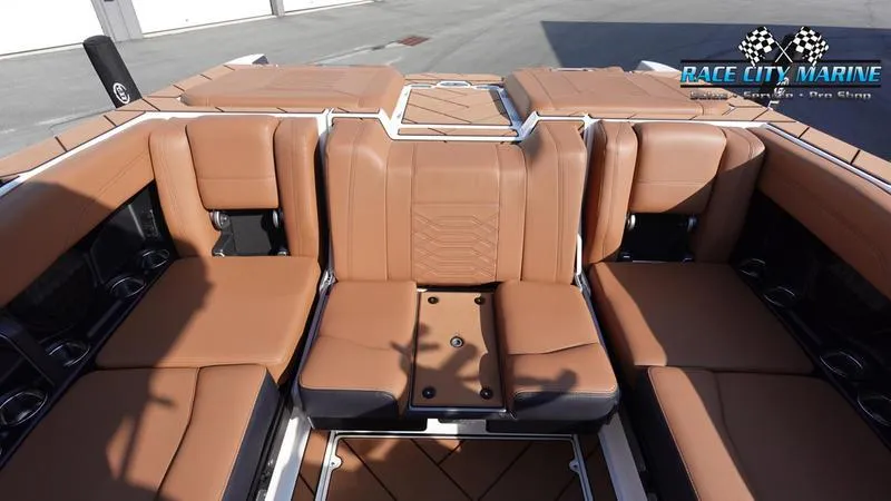Slide: The Image of 2023 Malibu 26 LSV boat interior with tan leather seating. - 20