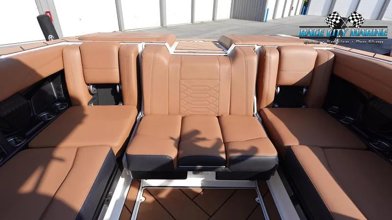 Slide: The Image of 2023 Malibu 26 LSV boat interior with tan leather seating. - 22