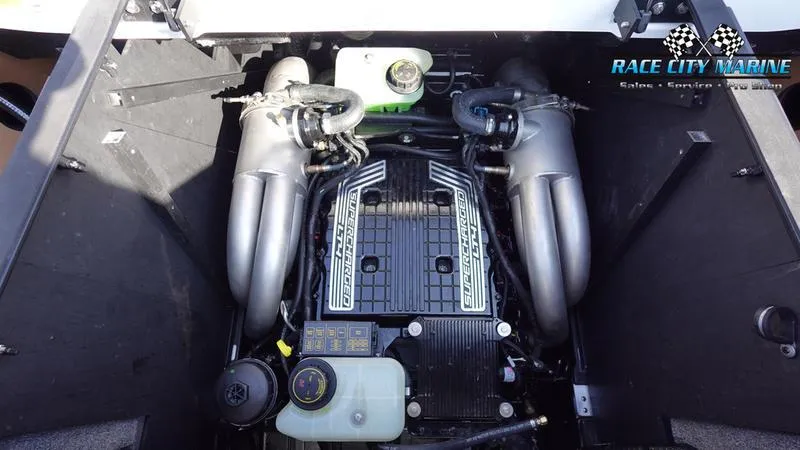 Slide: The Image of 2023 Malibu 26 LSV engine compartment, featuring powerful dual exhaust system. - 24