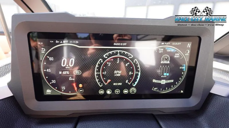 Slide: The Image of Dashboard display of 2023 Malibu 26 LSV boat showing RPM and speedometer. - 32