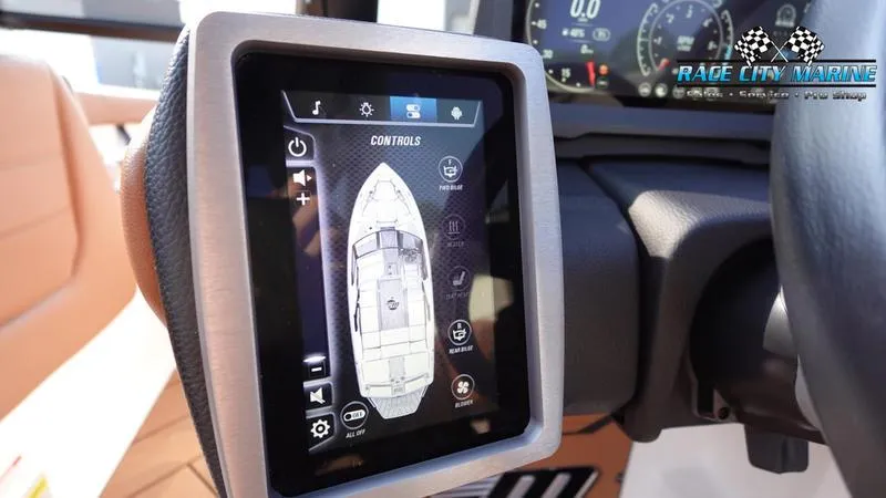Slide: The Image of 2023 Malibu 26 LSV boat dashboard with touchscreen controls. - 34