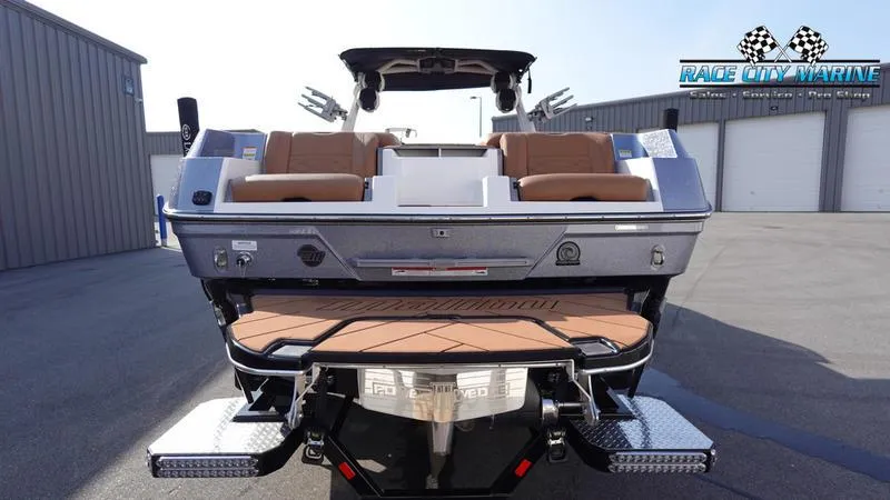 Slide: The Image of 2023 Malibu 26 LSV boat rear view at Race City Marine dealership. - 5