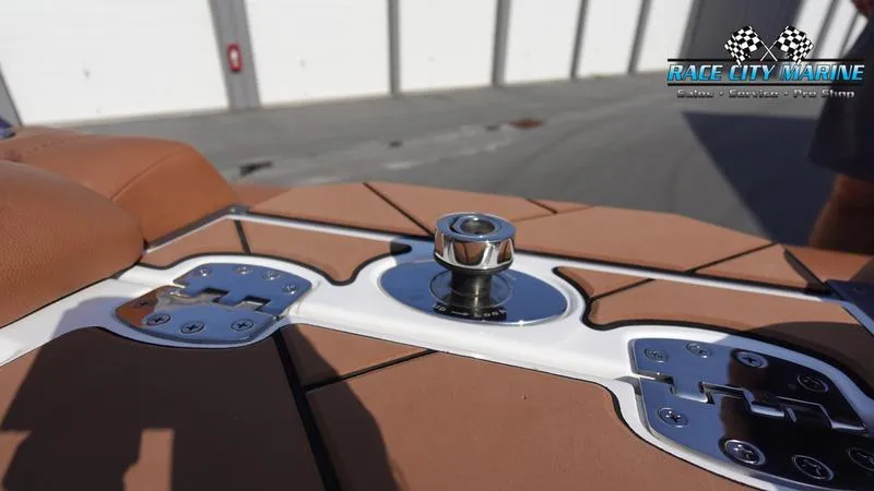 Slide: The Image of 2023 Malibu 26 LSV boat detail with tan upholstery and chrome fittings. - 9