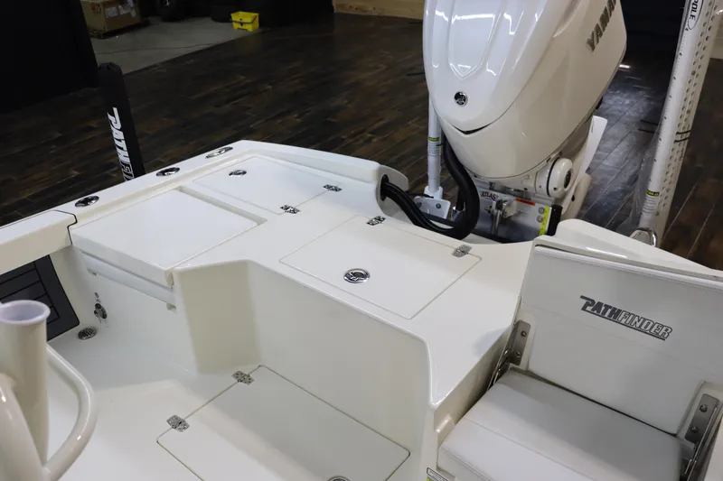 Slide: The Image of Pathfinder 2500 Hybrid 2025 boat interior with Yamaha engine, featuring storage compartments and seating. - 12