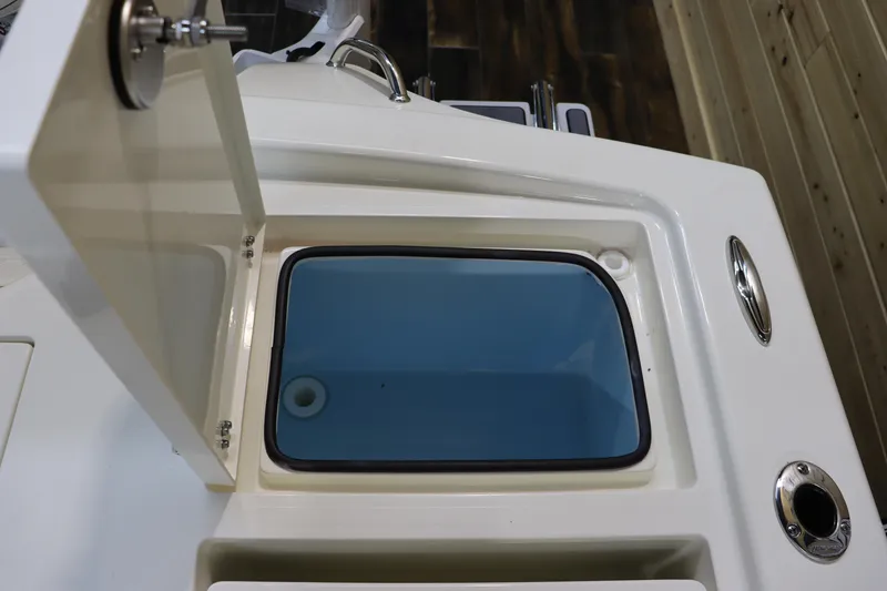 Slide: The Image of Pathfinder 2500 Hybrid 2025 boat storage compartment with open lid. - 14