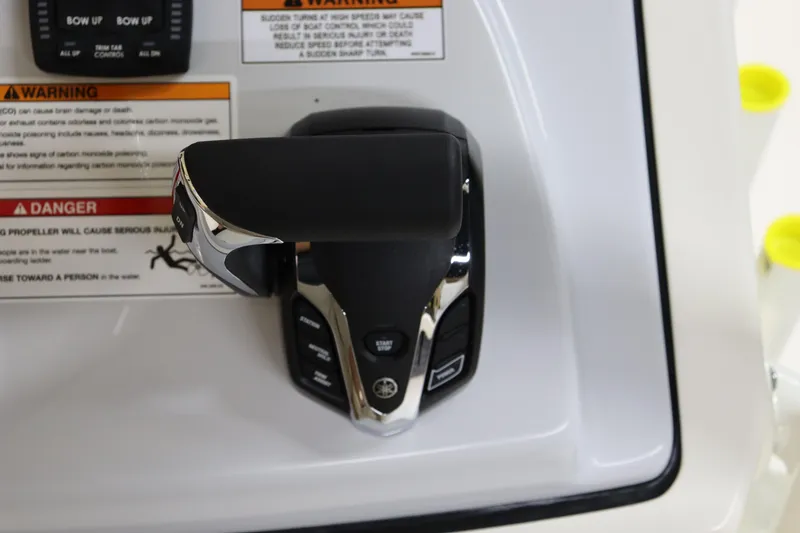 Slide: The Image of 2025 Pathfinder 2500 Hybrid control panel with throttle lever and warning labels. - 23