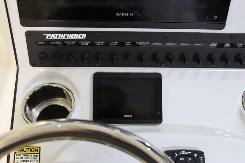 Slide: The Image of 2025 Pathfinder 2500 Hybrid boat dashboard with Garmin and Yamaha displays. - 24