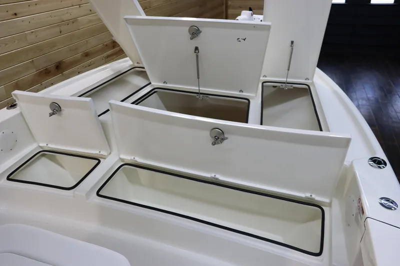 Slide: The Image of 2025 Pathfinder 2500 Hybrid boat storage compartments open, showcasing spacious design. - 27