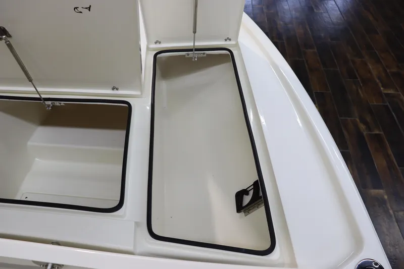 Slide: The Image of Open storage compartments on a 2025 Pathfinder 2500 Hybrid boat. - 30