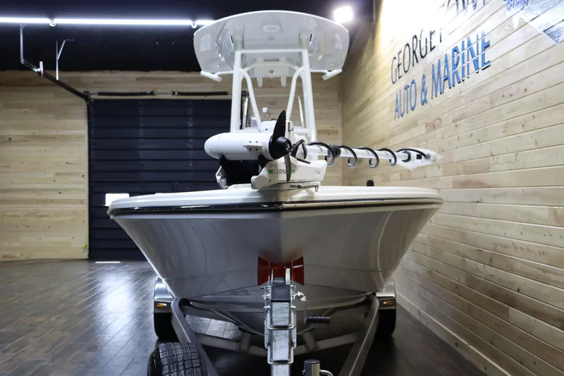 Slide: The Image of 2025 Pathfinder 2500 Hybrid boat in showroom, front view. - 6
