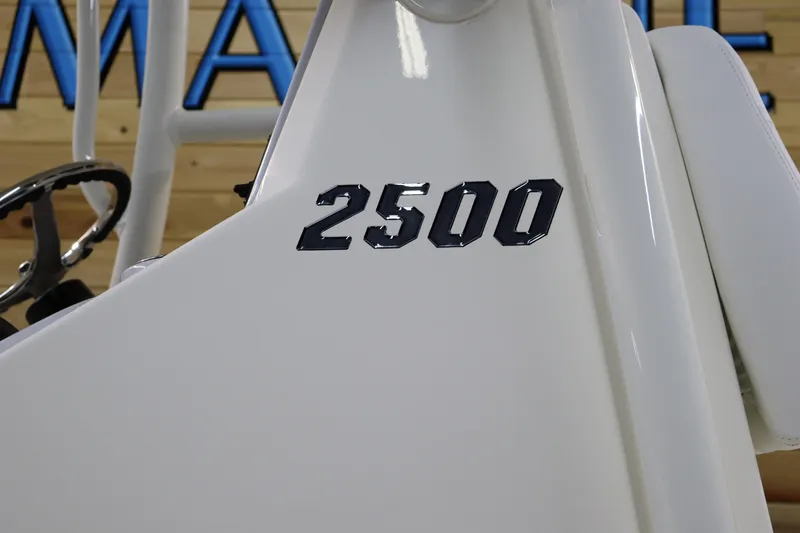 Slide: The Image of Pathfinder 2500 Hybrid 2025 boat console with steering wheel detail. - 8