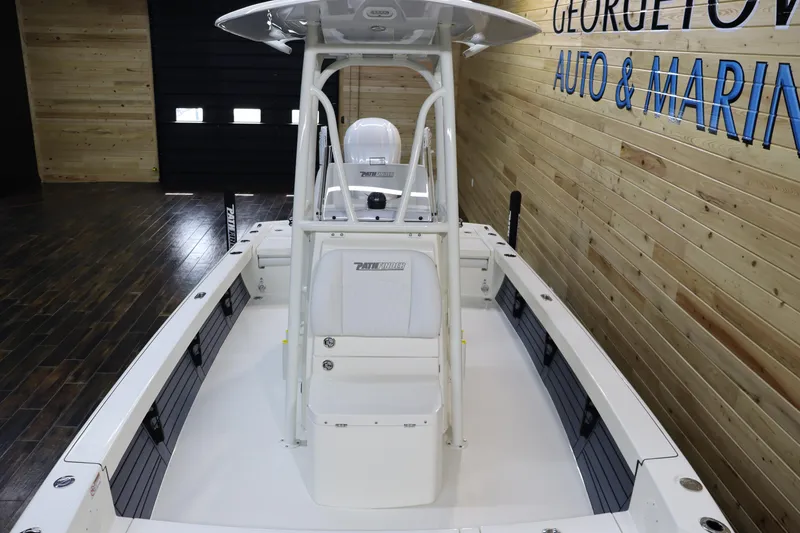 Slide: The Image of 2025 Pathfinder 2500 Hybrid boat in showroom, featuring sleek design and modern amenities. - 9