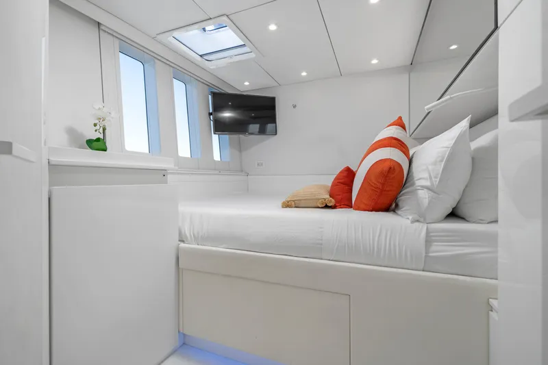 Slide: The Image of Luxurious Sunreef 70 yacht bedroom, modern design, 2016 model, with TV and vibrant pillows. - 19