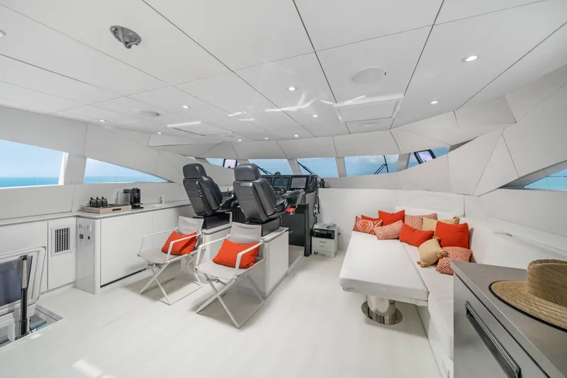 Slide: The Image of Luxurious interior of 2016 Sunreef 70 yacht with modern seating and vibrant cushions. - 26