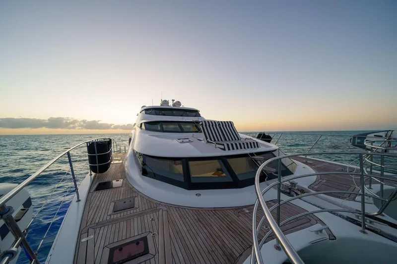 Slide: The Image of Luxurious 2016 Sunreef 70 yacht cruising at sunset on open sea. - 33