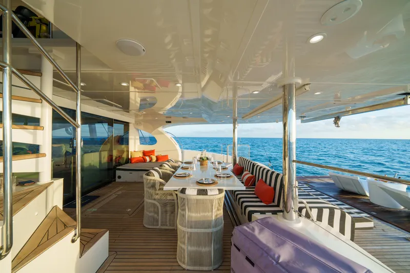 Slide: The Image of Luxurious Sunreef 70 yacht deck with dining area, ocean view, and stylish seating, 2016 model. - 36
