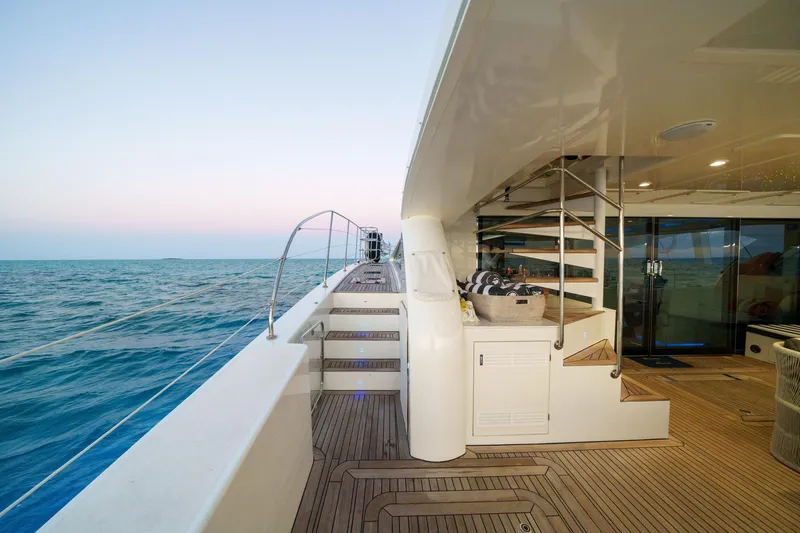 Slide: The Image of Luxurious 2016 Sunreef 70 yacht deck with ocean view and elegant staircase. - 39