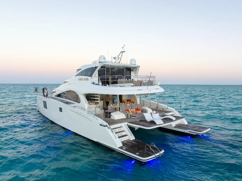Slide: The Image of Luxurious 2016 Sunreef 70 yacht on serene ocean waters at sunset. - 43