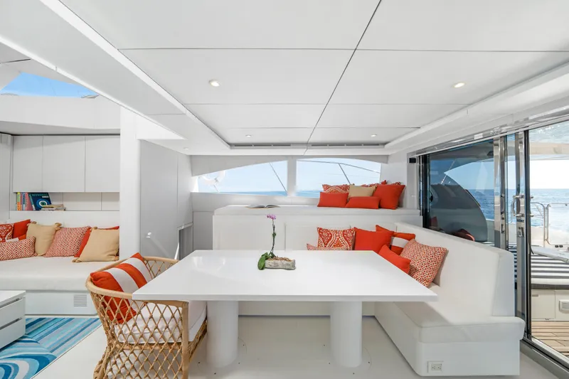 Slide: The Image of Luxurious Sunreef 70 yacht interior, featuring modern white and orange decor, 2016 model. - 5