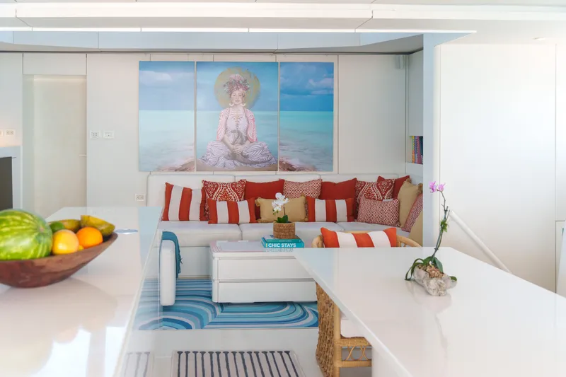 Slide: The Image of Luxurious Sunreef 70 yacht interior with modern decor, vibrant cushions, and fruit bowl. - 6
