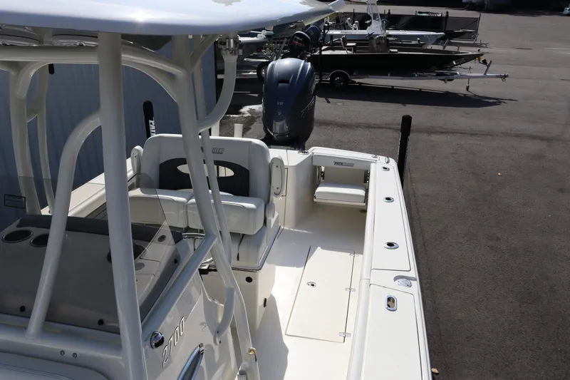 Slide: The Image of 2025 Pathfinder 2700 Open boat, spacious deck, modern design, parked outdoors. - 10