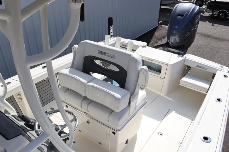 Slide: The Image of 2025 Pathfinder 2700 Open boat interior with seating and outboard motor. - 11