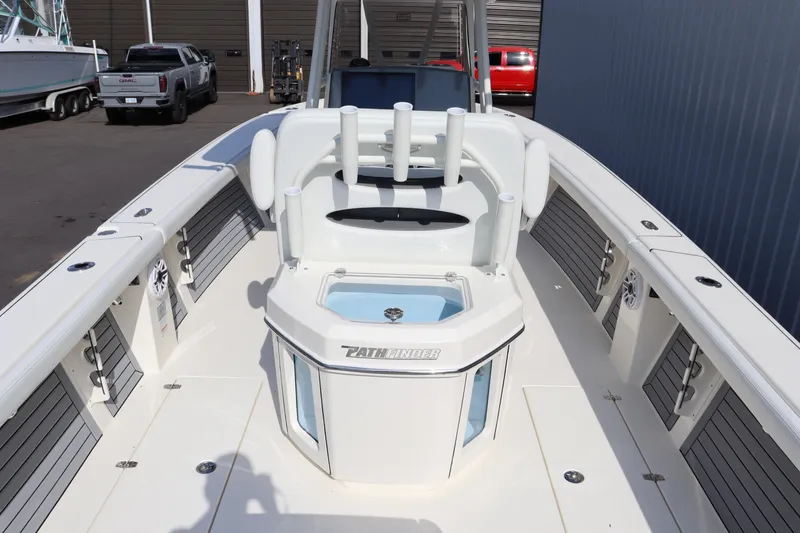 Slide: The Image of 2025 Pathfinder 2700 Open boat deck with seating and storage compartments. - 16