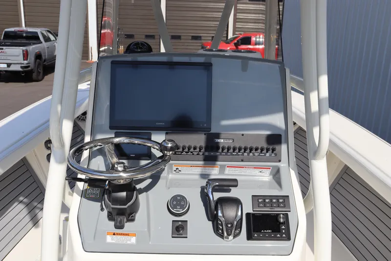Slide: The Image of 2025 Pathfinder 2700 Open boat console with steering wheel and navigation controls. - 20
