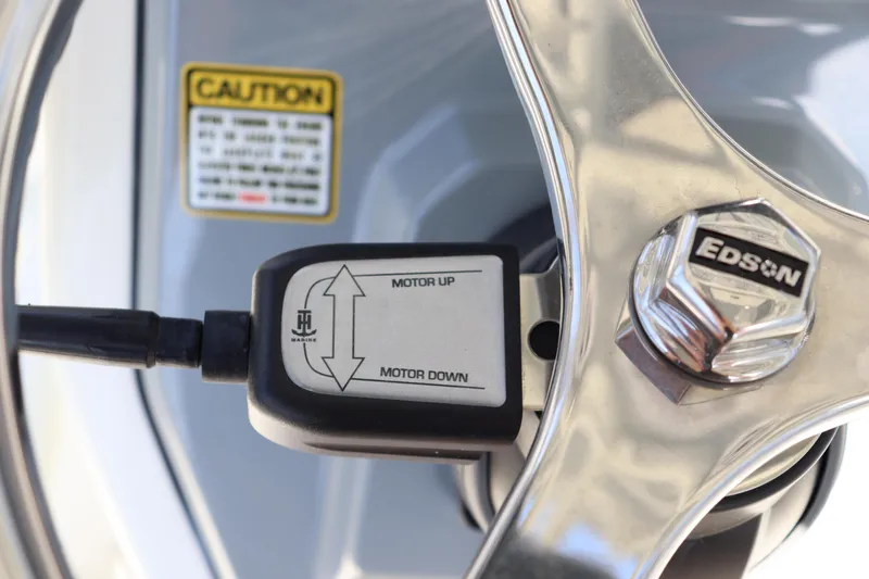 Slide: The Image of Close-up of 2025 Pathfinder 2700 Open boat steering wheel with motor control. - 21