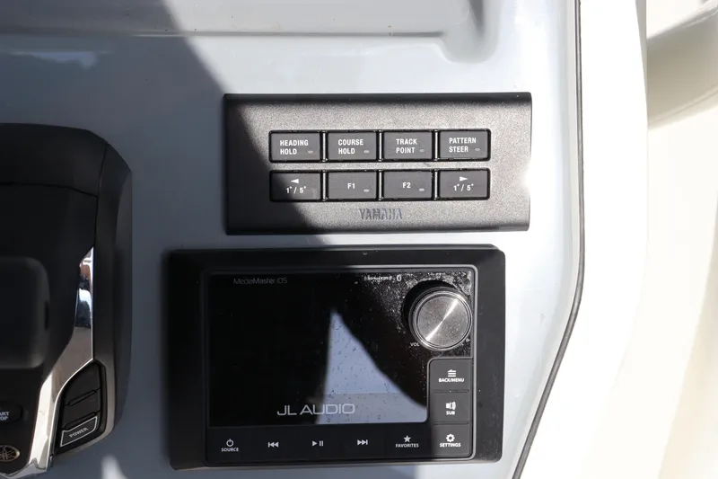 Slide: The Image of Yamaha control panel and JL Audio system on 2025 Pathfinder 2700 Open boat. - 23