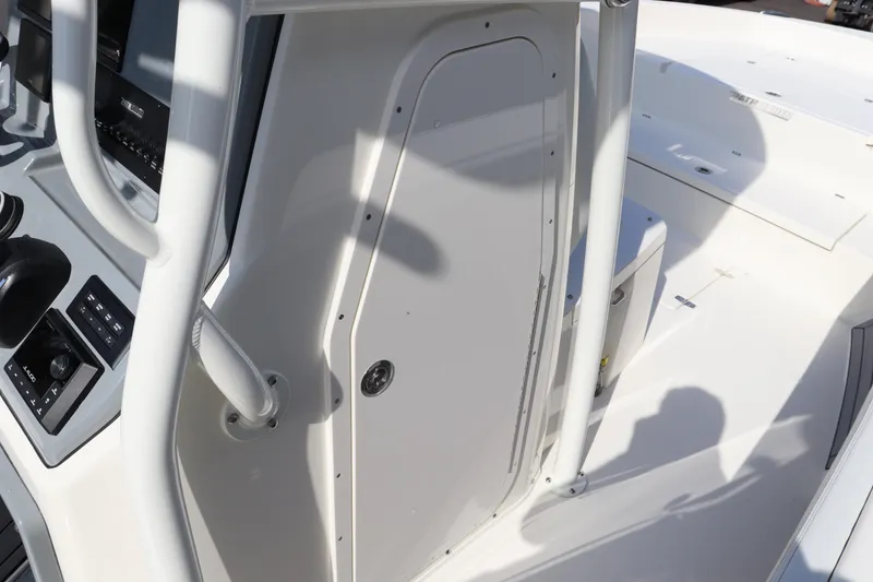 Slide: The Image of 2025 Pathfinder 2700 Open boat console and controls, sleek white design. - 25