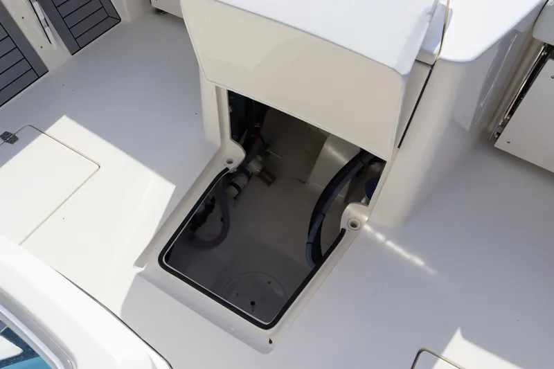 Slide: The Image of Pathfinder 2700 Open 2025 boat storage compartment with open hatch. - 34