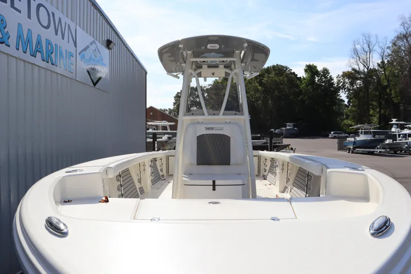 Slide: The Image of 2025 Pathfinder 2700 Open boat at a marina, showcasing sleek design and spacious deck. - 8