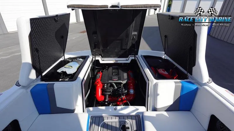 Slide: The Image of 2019 Nautique Super Air Nautique 230 engine compartment with open hatches. - 13