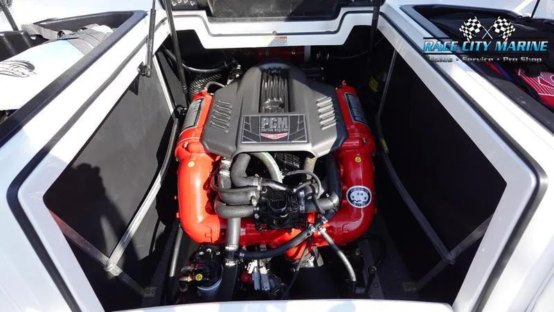 Slide: The Image of 2019 Nautique Super Air Nautique 230 engine compartment with PCM engine. - 14