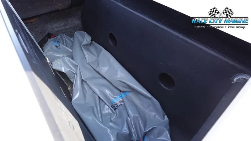 Slide: The Image of Storage compartment of 2019 Nautique Super Air Nautique 230 with Race City Marine branding. - 15