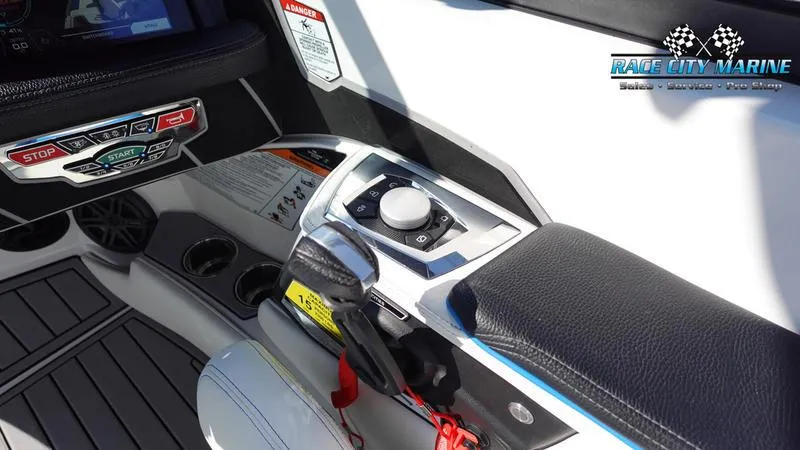 Slide: The Image of 2019 Nautique Super Air Nautique 230 control panel with throttle and start/stop buttons. - 20