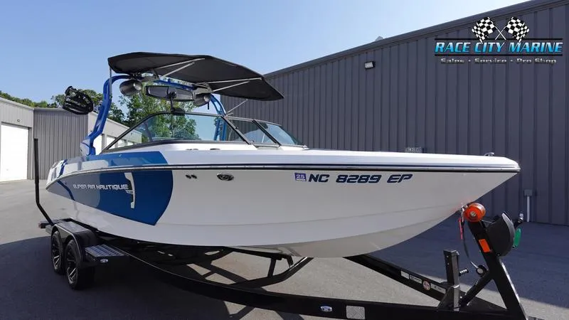 Slide: The Image of 2019 Nautique Super Air Nautique 230 boat on trailer at Race City Marine. - 3