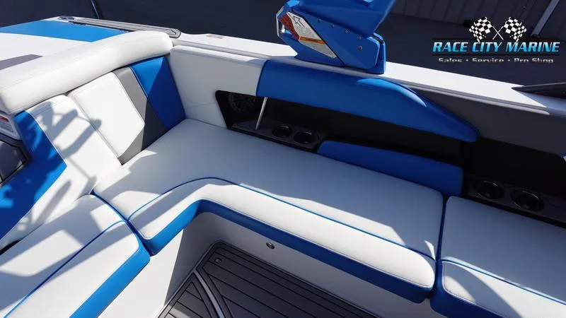 Slide: The Image of 2019 Nautique Super Air Nautique 230 interior with blue and white seating. - 31