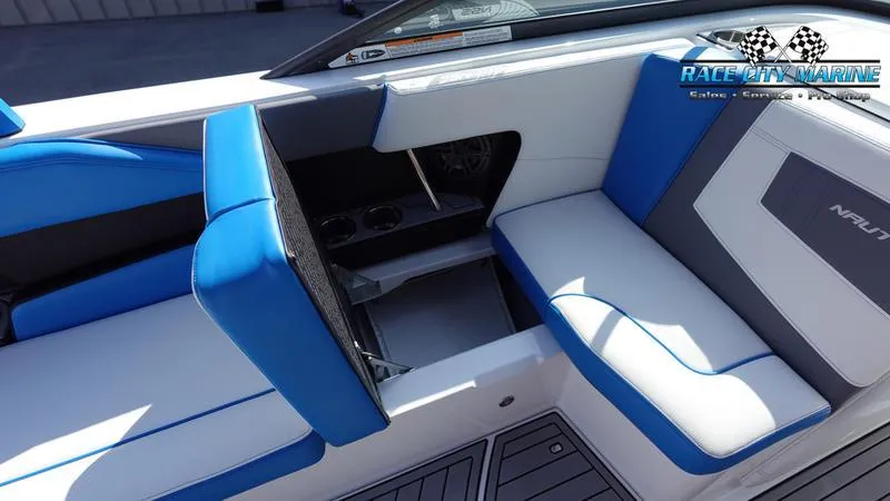 Slide: The Image of 2019 Nautique Super Air Nautique 230 interior with blue and white seating. - 33
