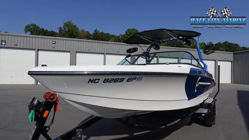 Slide: The Image of 2019 Nautique Super Air Nautique 230 boat on trailer at Race City Marine. - 4