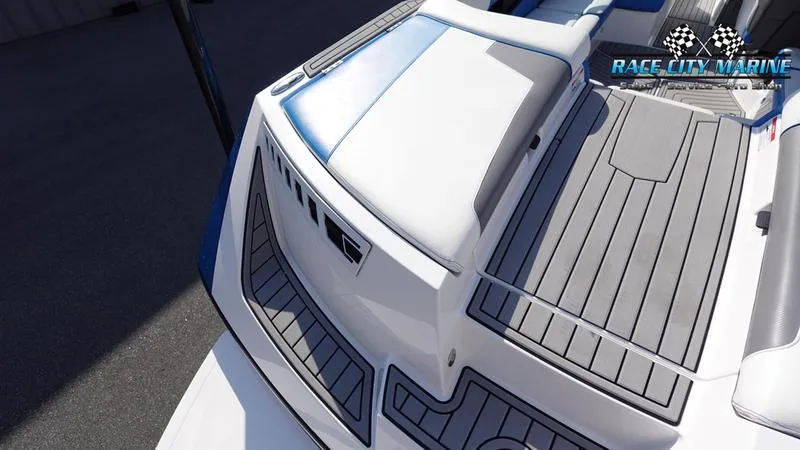 Slide: The Image of 2019 Nautique Super Air Nautique 230 boat deck with gray and white seating. - 8