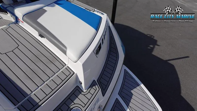 Slide: The Image of 2019 Nautique Super Air Nautique 230 boat deck with Race City Marine logo. - 9