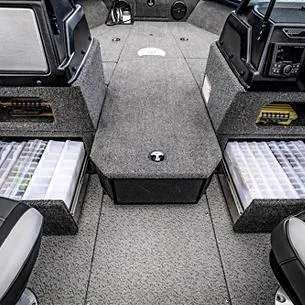 Slide: The Image of 2025 Lund Impact XS 1875 Sport boat interior with storage compartments and seating. - 5