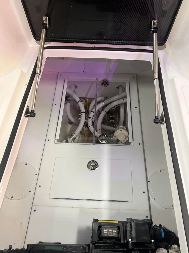 Slide: The Image of 2024 SeaHunter 35 Tournament boat interior with open hatch and visible wiring. - 18