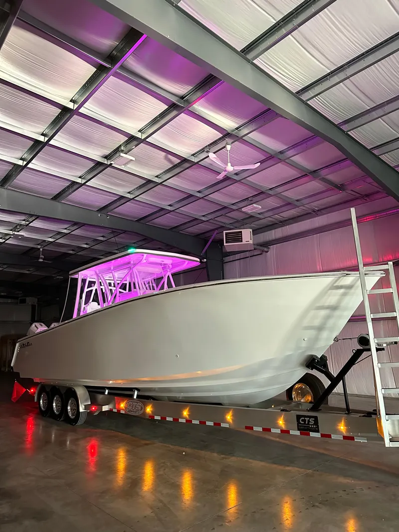Slide: The Image of 2024 SeaHunter 35 Tournament boat in a warehouse with purple lighting. - 29