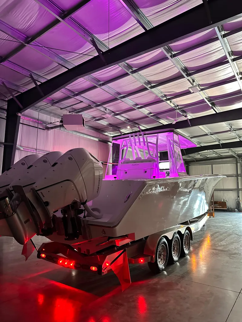 Slide: The Image of 2024 SeaHunter 35 Tournament boat in a warehouse with vibrant purple lighting. - 30