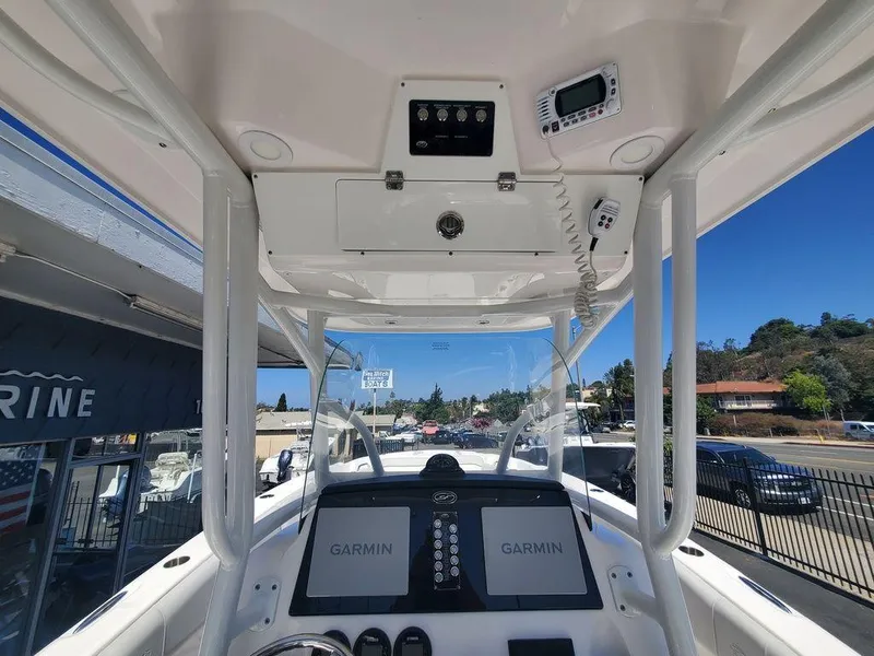 Slide: The Image of 2022 Sea Fox 268 Commander boat dashboard with Garmin navigation displays. - 18