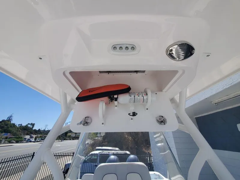 Slide: The Image of 2022 Sea Fox 268 Commander boat console with storage and safety equipment. - 19
